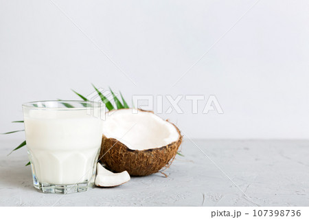 coconut products on white wooden table background. Dairy free milk substitute drink, Flat lay healthy eating 107398736
