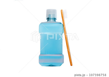 Mouthwash and other oral hygiene products on colored table top view with copy space. Flat lay. Dental hygiene. Oral care products and space for text on light background. concept Mouthwash and other oral hygiene products on colored table top view with copy space. Flat lay. Dental hygiene. Oral care products and space for text on light background. concept 107398758
