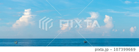 Sea sky cumulus cloud landscape view background. Calm water alone fishing boat. Destination aim progress concept Sea sky cumulus cloud landscape view background. Calm water alone fishing boat. Destination aim progress concept 107399669