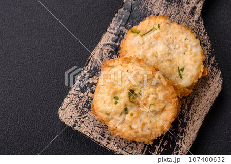 Delicious fried minced fish cutlets or meatballs with salt, spices and herbs 107400632