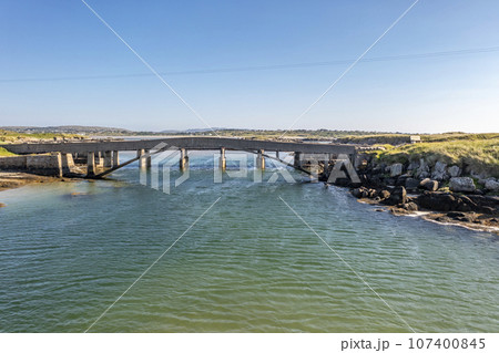 Aerial view of the bridge over the Atlantic to Cruit Island, County Donegal, Ireland 107400845