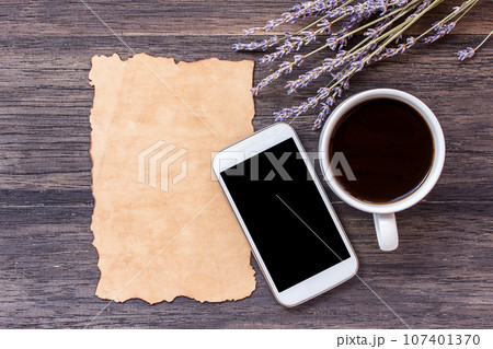 Old paper and coffee on dark wooden table background. 107401370