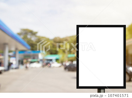 Blank advertising billboard or wide screen television with blurred gas station background Blank advertising billboard or wide screen television with blurred gas station background 107401571