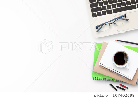 Cup of coffee with office tools on white background Cup of coffee with office tools on white background 107402098