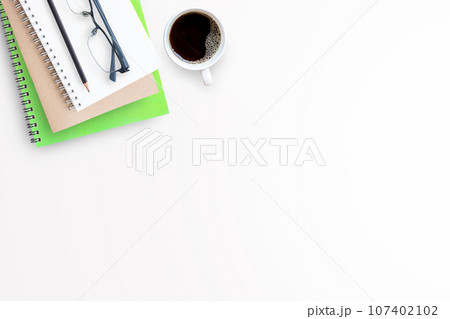 Cup of coffee with office tools on white background 107402102