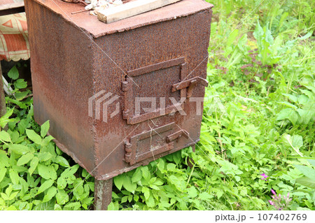An old homemade cast iron stove 107402769