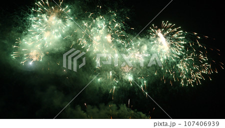 Green Firework celebrate anniversary happy new year 2022, 4th of july holiday festival. Green firework in night time celebrate national holiday. Countdown to new year 2022 festival party time event Green Firework celebrate anniversary happy new year 2022, 4th of july holiday festival. Green firework in night time celebrate national holiday. Countdown to new year 2022 festival party time event 107406939