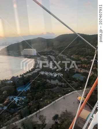 beautiful sunset on the ocean. Vietnam. The sun sets behind the horizon, through the coco, reflected in the water 107407931