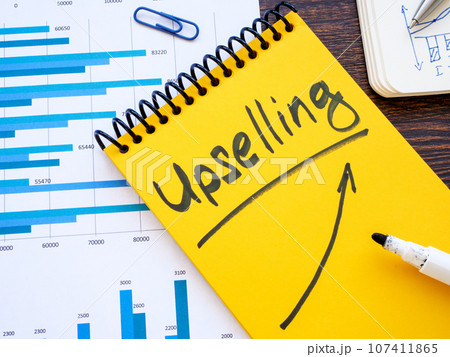 Open notepad with word upselling. 107411865