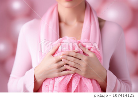 Pink scarf in female hands 107414125