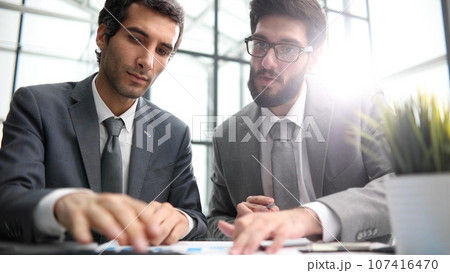 discussing financial report datas sales increase and profits, learn new business application, teamwork concept discussing financial report datas sales increase and profits, learn new business application, teamwork concept 107416470