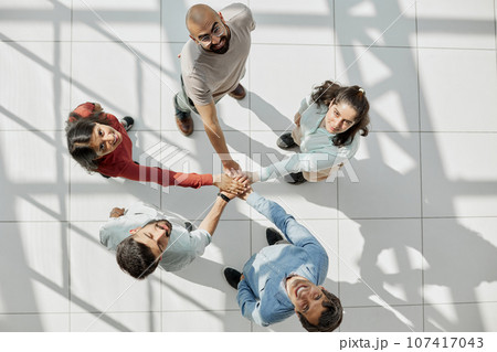 Close up hands Teamwork group of multi racial people meeting join hands. 107417043