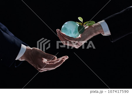 Plabt Growing inside a Sphere - Hand Holding - Eco Concept 107417590
