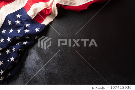 Happy Veterans day concept made from American flag on dark stone background. 107418936