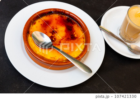Sweet custard crema catalana with caramelized sugar crust 107421330