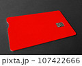 Green plastic bank card on a gray background. Mockup. Plastic card with chip. 107422666