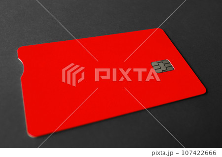 Green plastic bank card on a gray background. Mockup. Plastic card with chip. 107422666