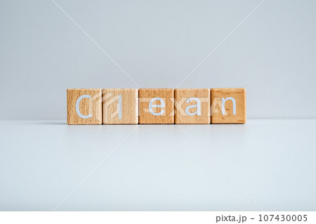 Wooden blocks form the text "Clean" against a white background. Wooden blocks form the text "Clean" against a white background. 107430005