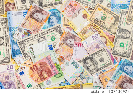 background of many different banknotes 107430925