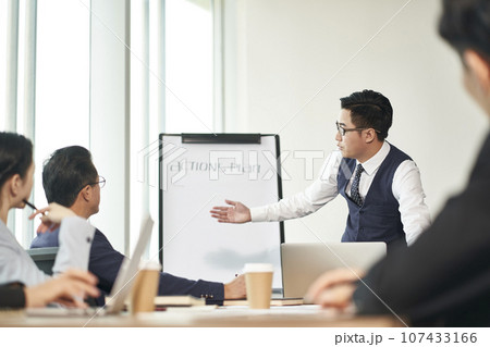 group of asian corporate executives meeting in office discussing business plans group of asian corporate executives meeting in office discussing business plans 107433166