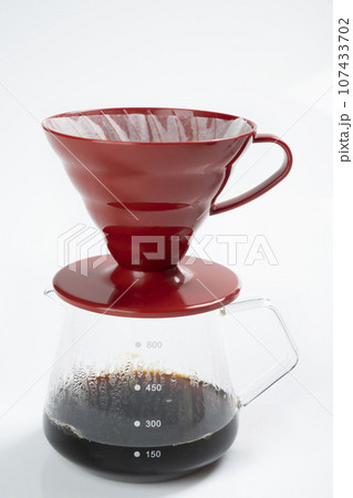 Cup of coffee with a V60 dripper coffee maker Cup of coffee with a V60 dripper coffee maker 107433702