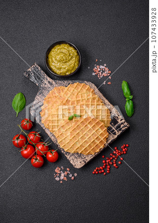 Round crispy wafers for making sweet delicious desserts or snacks Round crispy wafers for making sweet delicious desserts or snacks 107433928