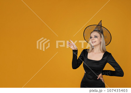 Girl in Halloween costume, with space for text 107435403