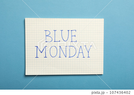 Paper with text Blue Monday on blue background, top view 107436402