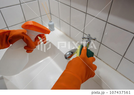 Woman maid asian or charwoman hand cleaning bathroom Woman maid asian or charwoman hand cleaning bathroom 107437561