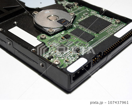 Hard drive, electronic circuit Board close-up. Components of electronic devices, macro photos. 107437961