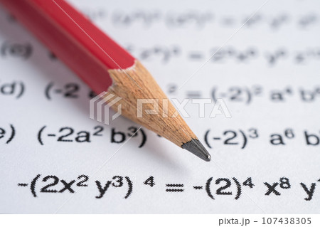 Pencil on mathematic formula exercise test paper in education school. 107438305