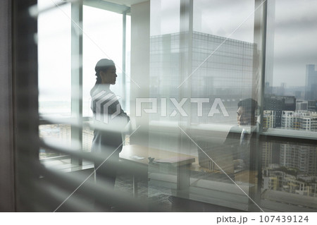 asian business man and woman talking in office asian business man and woman talking in office 107439124