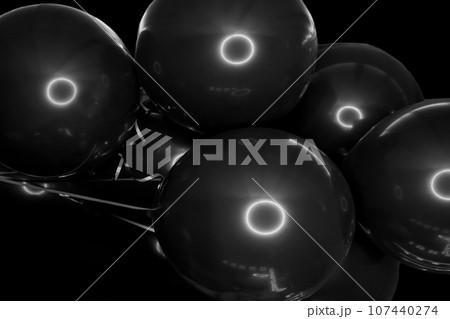 Black stylish helium air balloons for a modern holiday festival close up background Black stylish helium air balloons for a modern holiday festival close up background 107440274