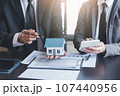 Finance and investment concept, Businessman present business finance investment plan with his partner, Investor colleagues discussing new investment plan by financial graph data on office table 107440956