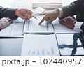 Finance and investment concept, Businessman present business finance investment plan with his partner, Investor colleagues discussing new investment plan by financial graph data on office table with 107440957