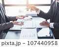 Finance and investment concept, Businessman present business finance investment plan with his partner, Investor colleagues discussing new investment plan by financial graph data on office table with 107440958