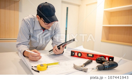Asian male Interior worker working with construction tools 107441943