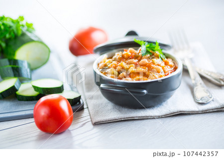Cooked white beans with zucchini and other vegetables. 107442357