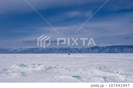 On the ice of Lake Baikal. beautiful pieces of ice. Ice hummock on the ice of lake Baikal On the ice of Lake Baikal. beautiful pieces of ice. Ice hummock on the ice of lake Baikal 107442947
