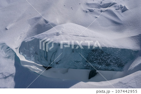 On the ice of Lake Baikal. beautiful pieces of ice. Ice hummock on the ice of lake Baikal On the ice of Lake Baikal. beautiful pieces of ice. Ice hummock on the ice of lake Baikal 107442955