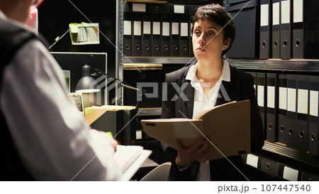 Detectives discussing about crime case in incident room, trying to put pieces together to solve mystery and catch culprit. Police experts team reviewing crucial information, classified records. Detectives discussing about crime case in incident room, trying to put pieces together to solve mystery and catch culprit. Police experts team reviewing crucial information, classified records. 107447540