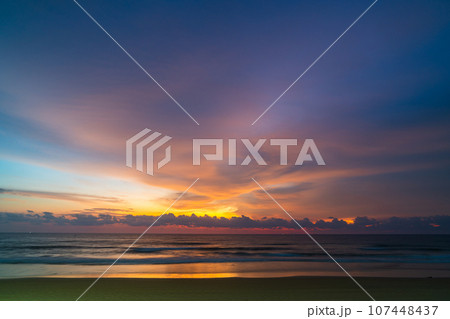 amazing pink sky above Karon beach Phuket at colorful sunset. sweet sky in colorful sunset above the ocean. Imagine a fantasy bright pink in blue sky at sunset. Sky texture background. 107448437