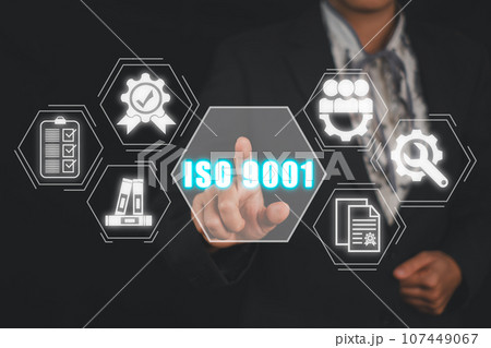 Iso 9001 concept, Business woman hand touching iso 9001 icon on virtual screen. 107449067