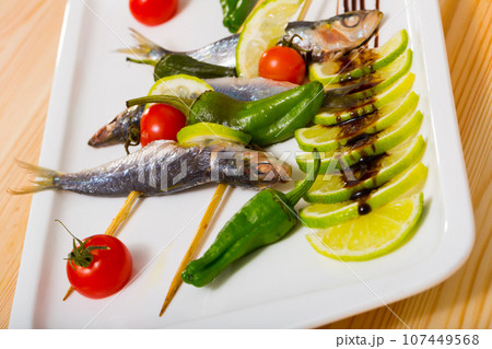 Sprats grilled with fresh vegetables Sprats grilled with fresh vegetables 107449568