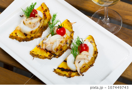 Cuttlefish with pineapple and cherry tomatoes 107449743