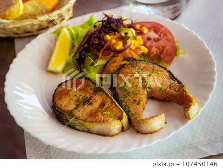 Fried salmon steaks 107450146