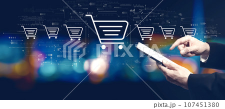 Online shopping theme with businessman using a tablet computer 107451380