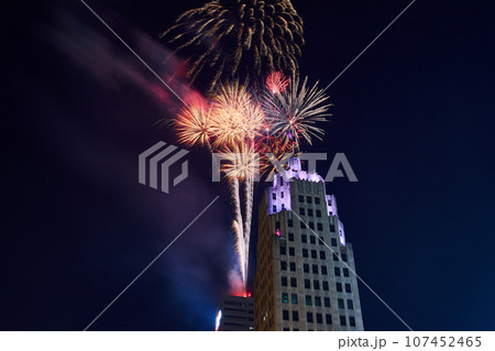 Close up of fireworks launching from Indiana Michigan Power building and purple top of Lincoln Tower 107452465