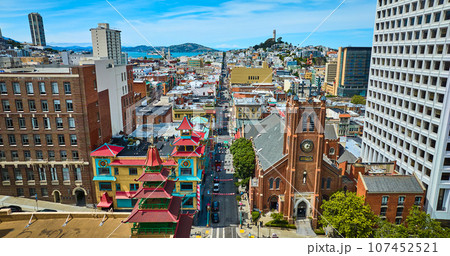 Distant San Francisco Bay and Coit Tower with view of Chinatown from drone aerial Distant San Francisco Bay and Coit Tower with view of Chinatown from drone aerial 107452521