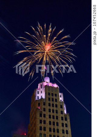 Downtown Fort Wayne Lincoln Tower with purple lights and golden 4th of July fireworks overhead Downtown Fort Wayne Lincoln Tower with purple lights and golden 4th of July fireworks overhead 107452668